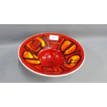 Poole Delphis red glazed bowl with printed backstamps, 24cm diameter