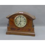 Mahogany cased mantle clock with silvered dial and Roman numerals, 29cm wide
