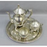 A three piece Epns tea set and an Epns circular tray (4)