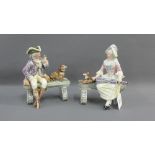 Pair of continental pottery male and female figures, each modelled seated on a bench with their