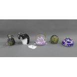 Collection of coloured glass paperweights to include Selkirk glass, (5)