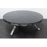 Stylish contemporary coffee table with black glass circular top on a chromed metal base, 42 x 100cm