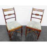 Pair of mahogany side chairs with carved vertical splats, upholstered slip in seats, and cross