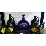 Collection of ceramic whisky decanters to include two in the shape of golf club heads, (5)