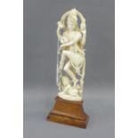 Early 20th century Indian carved ivory deity figure of Shiva, typically modelled standing upon