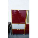 Modern home or office cabinet, with a pair of dark red vinyl cupboard doors over a tambour front and