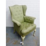 Wingback armchair with pale green upholstery, on cabriole legs, 104 x 75cm