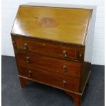 Mahogany bureau, the fall front opening to reveal a fitted interior, over pull out slides and