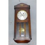 Oak cased wall clock, the silvered dial with Arabic numerals, 80cm long