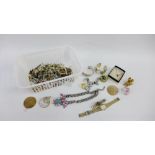 A collection of costume jewellery to include brooches, bangles and wristwatches etc (a lot)