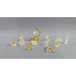 A collection of miniature crystal and gilt metal figures to include a dog and Mickey Mouse, etc (a