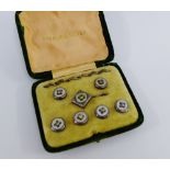 A set of six silver studs, boxed