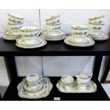 Coalport Ming Rose patterned tea set comprising nine cups, eleven saucers, two sugar bowls, a cake