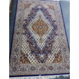 Eastern rug, the ivory field with all over foliate design with flowerhead border, 205 x 125cm