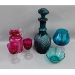 Quantity of coloured glass to include a cranberry glass jug, two wine glasses and a green glass