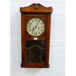 Oak cased wall clock with silvered dial and Arabic numerals, 70 x 33cm