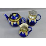 Royal Doulton blue glazed stoneware part teaset to include teapot, milk jug and hot water pot,