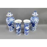 Pair of Chinese high shouldered blue and white baluster vases with covers, together with a pair of