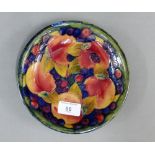 Moorcroft pottery shallow dish in Pomegranate pattern, impressed and facsimile marks verso, 19cm