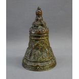 Bronze Thai style bell with figures and stylised motifs, 18cm high