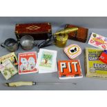 Mixed lot to include vintage tins, cocktail strainer, button hooks, sugar tongs, vintage card games,