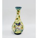 Moorcroft bottle neck vase with flowers and foliage, with impressed and printed backstamps, signed