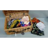 Wicker basket containing a quantity of silk scarves etc., (a lot)