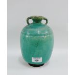 Chinese green glazed vase with twin handles to top, 21cm