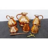 Collection of five copper jugs, funnel and a brass tap, etc 41 x 41cm