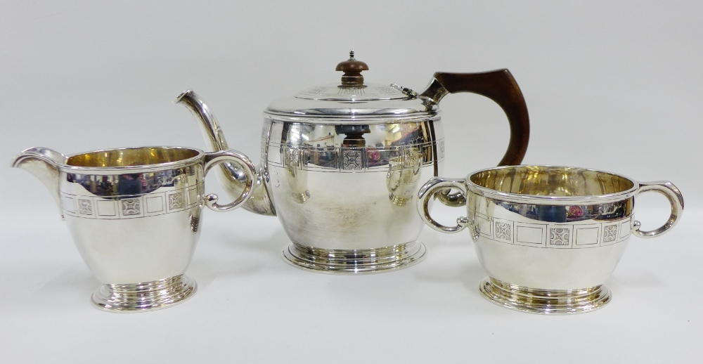 George V silver three piece teaset comprising teapot, milk jug and sugar bowl, makers mark for
