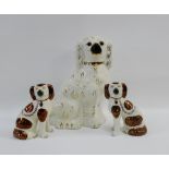 Pair of Staffordshire small chimney spaniels with another larger, (3)