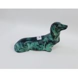 Bronze patinated model of a miniature dachshund, 25cm long