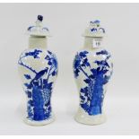 Pair of Chinese blue and white high shouldered baluster vases and covers with bird and flowering