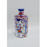 Chinese octagonal bottle necked vase with flower and foliage pattern, 17cm high