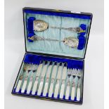 Cased set of six Epns and mother of pearl handled fruit knives and forks complete with a pair of