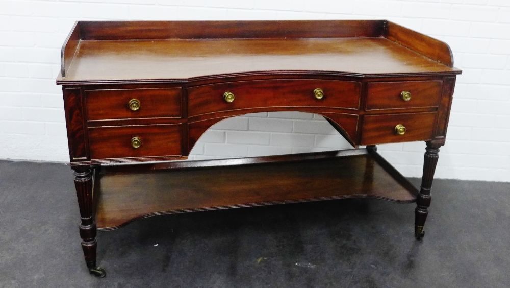 19th century mahogany desk with a three quarter ledgeback over an arrangement of five drawers,