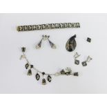 A collection of silver and white metal Siam style jewellery to include bracelets and earrings,
