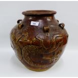 Provincial Ming Dynasty brown glazed Mataban food jar with Dragon pattern all around and loop