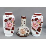 Pair of opaque floral patterned vases and another similar, (3)