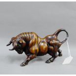 Bronze patinated resin figure of a Bull, 24cm long