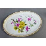19th century oval Meissen porcelain tray, outside decorated with flower sprays within a gilt border,