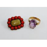 Unmarked yellow metal and coral brooch with glazed panel and an unmarked yellow metal gemset ring (
