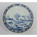 Delft blue and white charger with windmill and landscape scene, signed J Sonneville, 39cm diameter