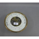 Circular brass cased aneroid wall barometer