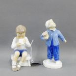 Bing & Grondahl porcelain figure of a Boy modelled seating drinking from a cup, together with