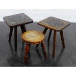 A collection of three milking stools to include two with floral carved tops, (3)