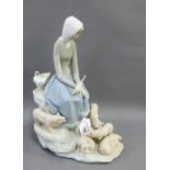 Lladro porcelain figure of a Girl, modelled seated with piglets at her feet, with printed