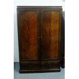 Whytock and Reid mahogany wardrobe, early 20th century, the cornice over a pair of panelled doors