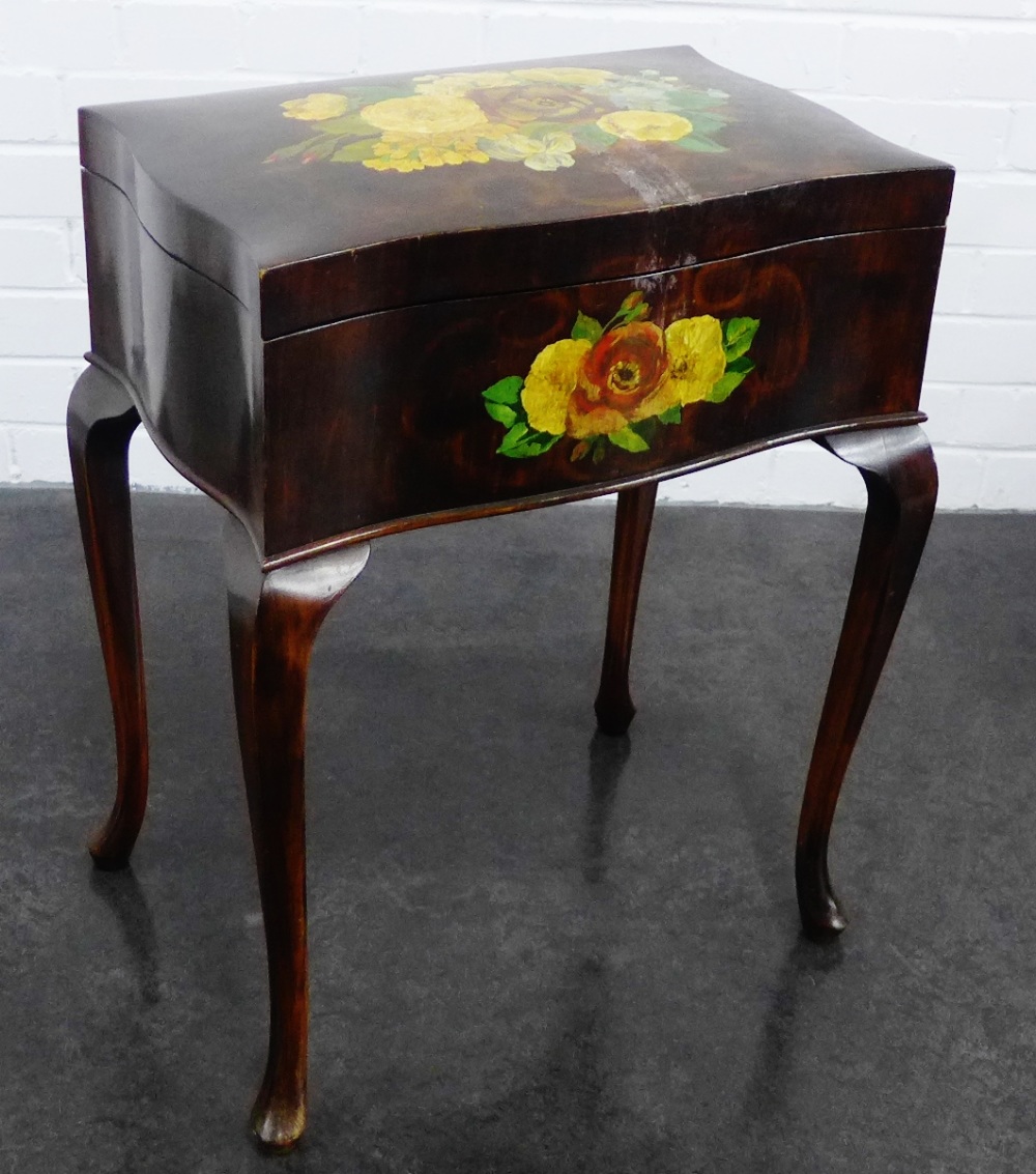 Serpentine sewing box / table, with floral painted pattern and on cabriole legs, 70 x 46cm