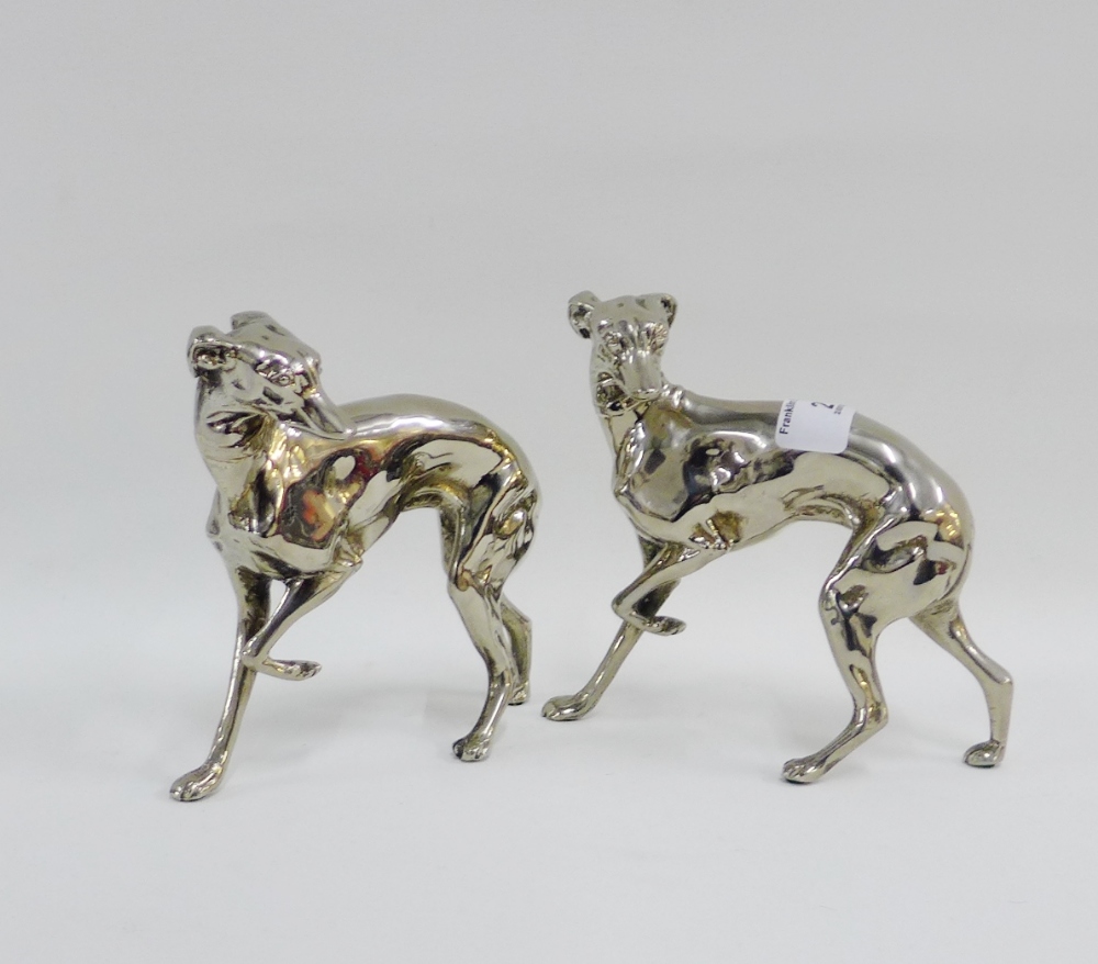 Two white metal greyhound figures, 14cm high (2)